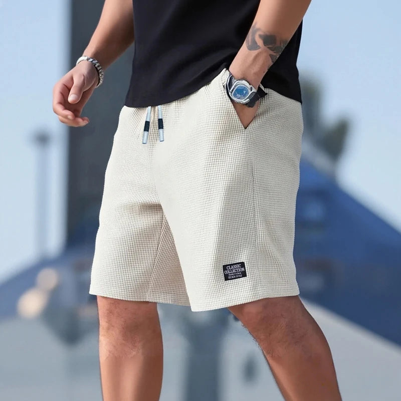 Pantalones cortos y casuales para hombre, shorts de playa y deportivos, nueva moda en tejido texturizado, pantalones transpirables, adecuados tanto para uso diario casual como para practicar deporte.