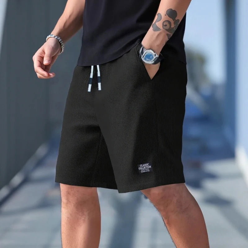 Pantalones cortos y casuales para hombre, shorts de playa y deportivos, nueva moda en tejido texturizado, pantalones transpirables, adecuados tanto para uso diario casual como para practicar deporte.