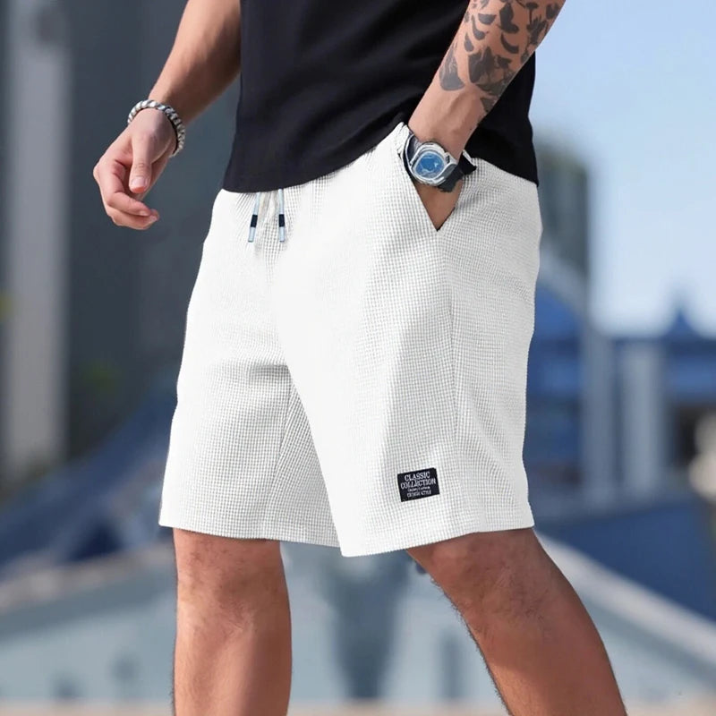 Pantalones cortos y casuales para hombre, shorts de playa y deportivos, nueva moda en tejido texturizado, pantalones transpirables, adecuados tanto para uso diario casual como para practicar deporte.