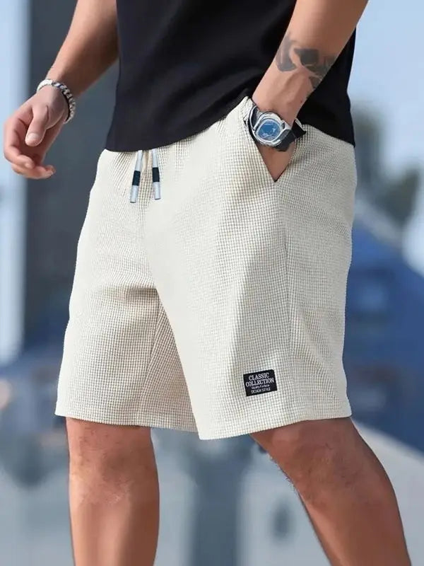 Pantalones cortos y casuales para hombre, shorts de playa y deportivos, nueva moda en tejido texturizado, pantalones transpirables, adecuados tanto para uso diario casual como para practicar deporte.